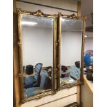 A MATCHING PAIR OF BEVELLED EDGE AND GLASS ORNATE MIRRORS WITH GILDED BORDERS 67 X 30CM