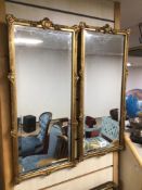 A MATCHING PAIR OF BEVELLED EDGE AND GLASS ORNATE MIRRORS WITH GILDED BORDERS 67 X 30CM