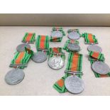 A QUANTITY OF 1939-1945 DEFENCE MEDALS WITH RIBBONS
