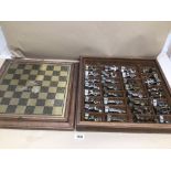 A CHESS SET MADE UP WITH WEIGHTED HEAVY METAL FIGURES