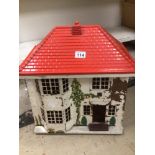 A VINTAGE TRIANG 40 WOOD AND METAL DOLLS HOUSE