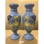 A PAIR OF BLUE HANDPAINTED GLASS VASES DECORATED WITH FLOWERS AND BUTTERFLIES 36CM