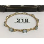 A 585 YELLOW GOLD AND WITH TOPAZ STONES BRACELET TOTAL LENGTH 22CM TOTAL WEIGHT 17 GRAMS