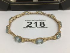 A 585 YELLOW GOLD AND WITH TOPAZ STONES BRACELET TOTAL LENGTH 22CM TOTAL WEIGHT 17 GRAMS