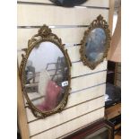 A PAIR OF VINTAGE ORNATE AND GILDED FRAMED MIRRORS OF OVAL FORM LARGEST IS 49 X 28CM