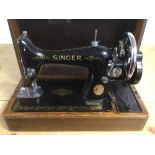 A CASED VINTAGE SINGER SEWING MACHINE