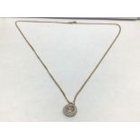A 14K 585 PENDANT WITH AN ITALY 9 CARAT NECKLACE TOTAL WEIGHT 5 GRAMS