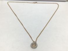 A 14K 585 PENDANT WITH AN ITALY 9 CARAT NECKLACE TOTAL WEIGHT 5 GRAMS