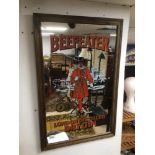 A VINTAGE FRAMED MIRROR BEEFEATER LONDON DRY GIN 89 X 57 CM