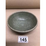 A CHINESE PORCELIAN CELADON BOWL A/F 12CM DIAMETER