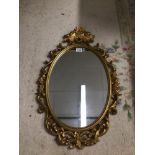 A MODERN ROCCO STYLE MIRROR 76 X 50CM