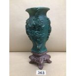 A CARVED PIECE OF CHINESE JADITE ON STAND A/F 25CM