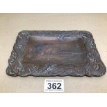 AN ANTIQUE JAPANESE BRONZED TRAY WITH A RIVER SCENE AND CHASING DRAGONS AROUND THE BORDERS