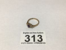 A 9CT GOLD RING WITH 12 DIAMONDS AND AMETHYST SET IN 9CT GOLD SIZE N 2 GRAMS
