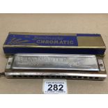 AN ORIGINAL BOXED VINTAGE GERMAN HARMONICA (THE BANDMASTER CHROMATIC DELUXE)