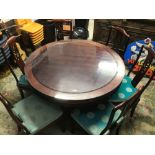 A VINTAGE STYLE EASTERN ROUND TABLE WITH SIX DINING CHAIRS GLASS TOP BASE WITH LIGHT DIAMETER 122