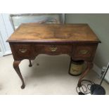 A THREE DRAWER 19TH CENTURY DESK ON CABRILOE LEGS