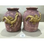 TWO POTTERY VASES WITH EMBOSSED DRAGONS TO THE SIDES 23CM