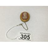 A CARVED OVAL CAMEO CARNELIAN IN AN UNMARKED 14CT GOLD OVAL MOUNT WITH APPLIED BEAD AND ROPE WORK