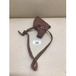 A VINTAGE LEATHER HOLSTER POSSIBLY FOL LUGER