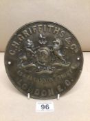 A 19TH/20TH CENTURY ROUND METAL WALL PLAQUE C.H GRIFFITHS & CO LONDON