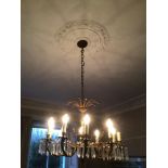 A ROCOCO GILDED BRONZE CHANDELIER WITH CRYSTAL DROPS