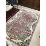 A VINTAGE CHINESE RUG 242 X 148CM