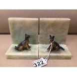 A PAIR OF ONYX BOOKENDS WITH STATUES OF DOGS