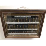 FRAMED AND GLAZED COLLECTION OF PISTOL AND REVOLVER AMMUNITION 37 X 29CM