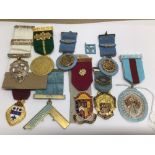 A QUANTITY OF MASONIC MEDALS WITH RIBBONS SOME SILVER WITH GOLD GILT