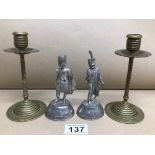 A PAIR OF EDWARDIAN BRASS CANDLESTICKS 15CM WITH TWO PEWTER MILITARY FIGURES 1CM ONE BY C. STADDEN