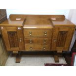 A GOLDEN OAK ART DECO SIDEBOARD WITH BRASS DROP HANDLES