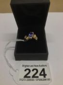 A 14CT YELLOW GOLD RING WITH AMETHYST AND SIX DIAMONDS SET IN PLATINUM SIZE M.5 3 GRAMS