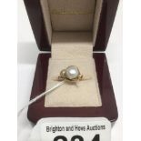 A MARKED 14CT GOLD RING WITH A SEEDED PEARL SIZE K 2 GRAMS TOTAL WEIGHT