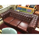 A VINTAGE BROWN LEATHER CHESTERFIELD