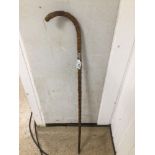 A LATE 19TH CENTURY HAWTHORN WALKING CANE WITH SILVER BAND