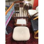 A CANADIAN WOODEN ROCKING CHAIR WITH STOOL