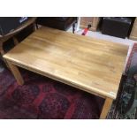 A MODERN WOODEN COFFEE TABLE 118 X 74 X 50CM