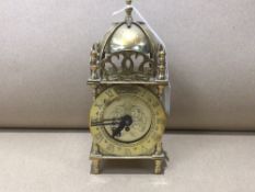 A SMITHS BRASS LANTERN-STYLE MANTEL CLOCK 19CM