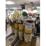 A FOUR-PERSON CHINESE DRAGON COSTUME COMPLETE WITH TROUSERS AND SHOES