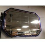 AN ART DECO BLUE AND PINK WALL MIRROR 92 X 65CM