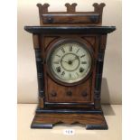 A 19TH CENTURY GERMAN WALNUT AND EBONISED MANTLE CLOCK WITH A CIRCULAR DIAL 43CM HIGH