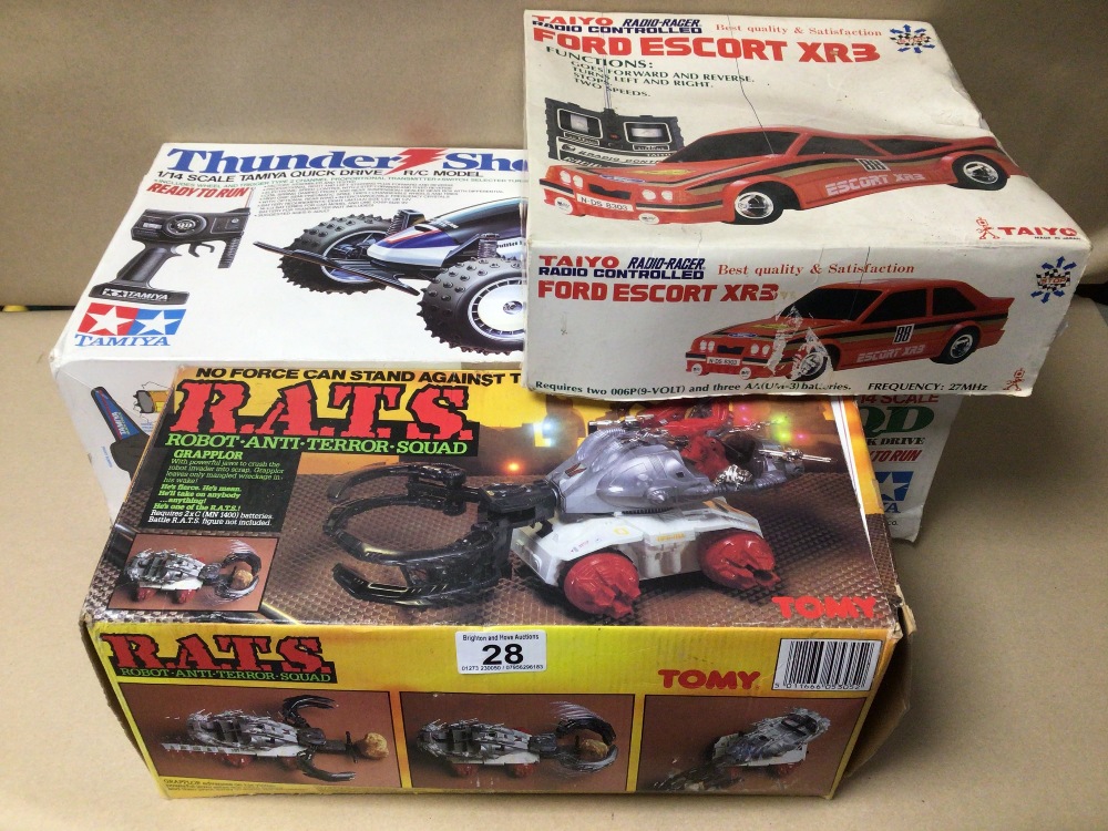 THREE BOXED REMOTE CONTROL TOYS, THUNDER SHOT BY TAMIYA, FORD ESCORT XR3 BY TAIYO, AND R.A.T.S BY