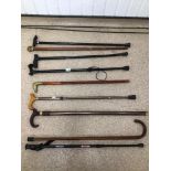 A QUANTITY OF MAINLY WALKING STICKS, CARVED BADGER, HIKING STICK AND UMBRELLA