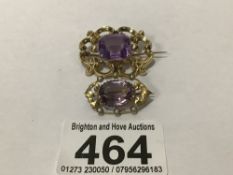 TWO ANTIQUE YELLOW METAL AND AMETHYST BROOCHES, SMALLER STAMPED 9CT WITH VERDIGRIS AND ONE SPLIT, UK