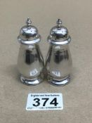 A PAIR OF SILVER HALLMARKED BALUSTER SHAPED PEPPER POTS 1919 BIRMINGHAM 53 GRAMS