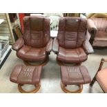 A PAIR OF EKORNES STRESSLESS PINK ARMCHAIRS WITH STOOLS