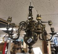 A VINTAGE BRASS SIX BRANCHED CHANDELIER APPROXIMATELY 40CM X 40CM