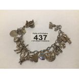 A STERLING SILVER CHARM BRACELET 16 CHARMS SOME LOSS TO RHODIUM PLATING, OTHERWISE GOOD