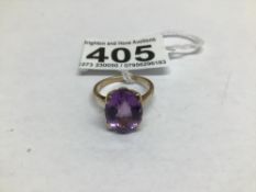 A MARKED 9CT GOLD RING WITH A LARGE SINGLE AMETHYST SIZE N